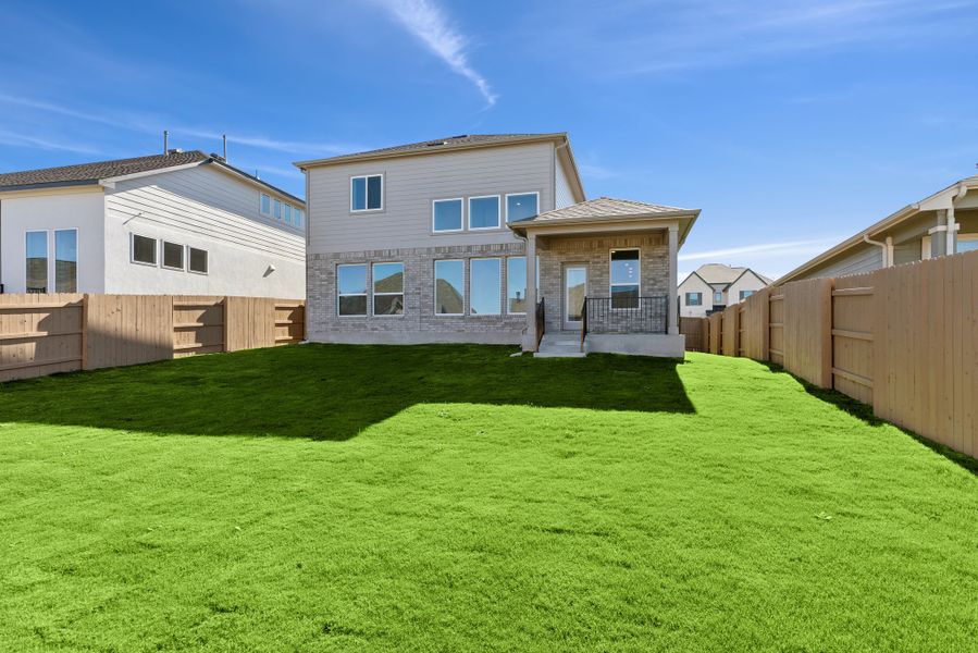 Exterior details and patio area of a home in The Colony, Bastrop (Image 4).