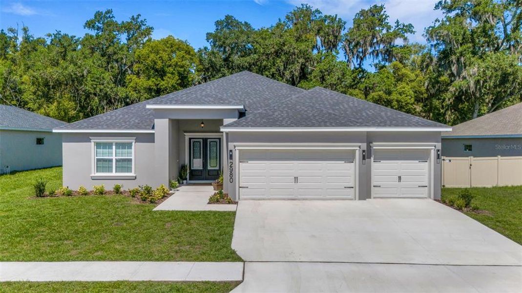 Front exterior of a new home in , Lakeland, FL, highlighting curb appeal (Image 23). Front exterior of a new home in , Lakeland, FL, highlighting curb appeal (Image 23).