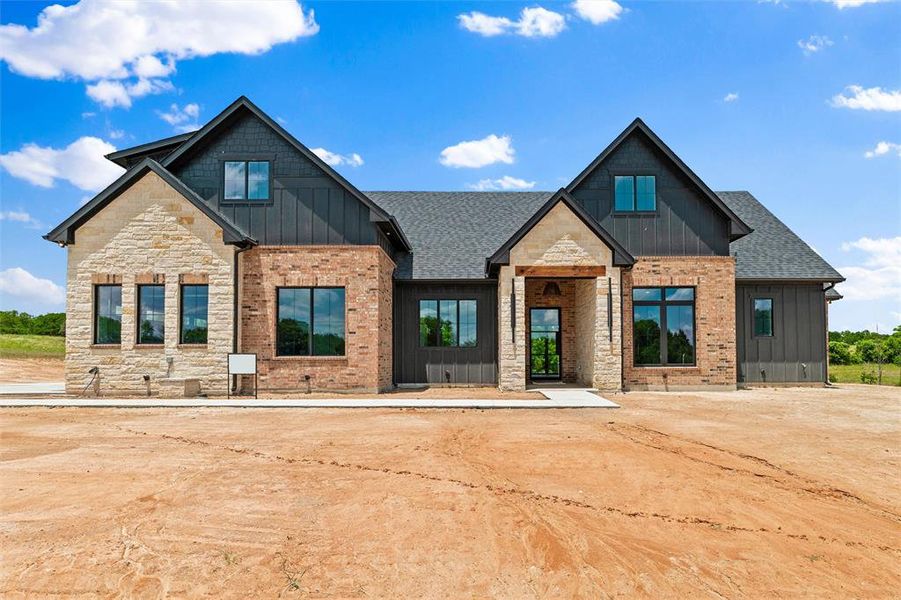 Front exterior of a new home in , Poolville, TX, highlighting curb appeal (Image 25). Front exterior of a new home in , Poolville, TX, highlighting curb appeal (Image 25).