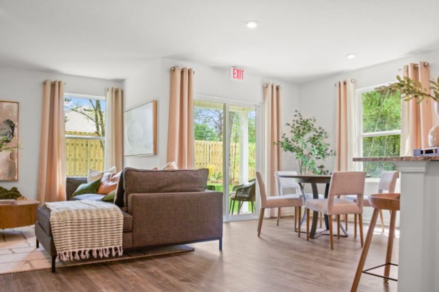 A living room with a wood floor.