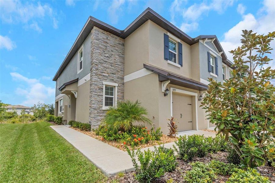 Front exterior of a new home in , Land O' Lakes, FL, highlighting curb appeal (Image 23).