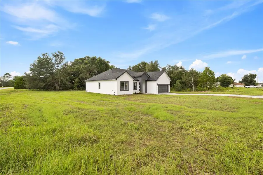 Front exterior of a new home in , Ocala, FL, highlighting curb appeal (Image 24). Front exterior of a new home in , Ocala, FL, highlighting curb appeal (Image 24).