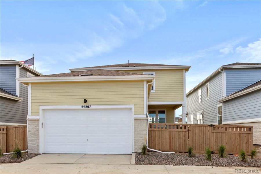 Exterior details and patio area of a home in Windler Single Family Homes, Aurora (Image 14).