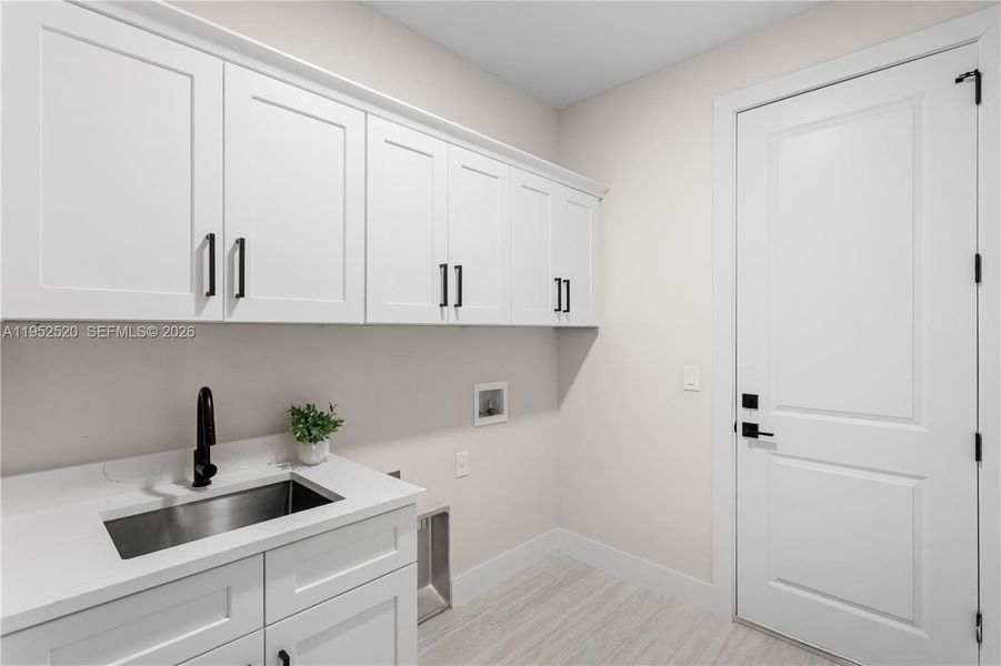 LAUNDRY, 3-CAR GARAGE & long-lasting METAL ROOF complete HOMES' FUNCTIONAL FEATURES.