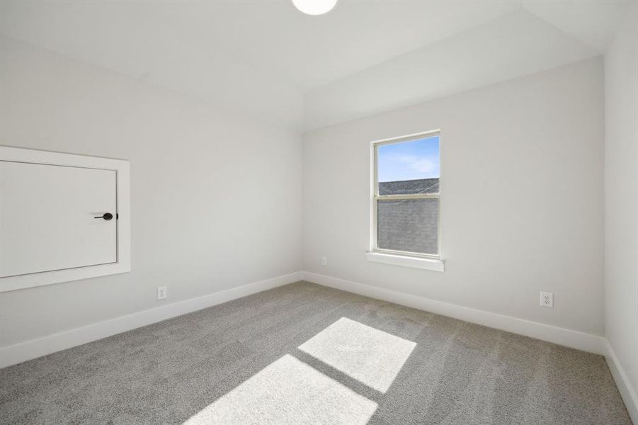 Empty room with carpet flooring