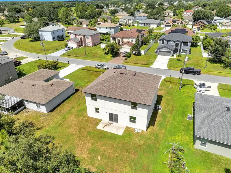 Front exterior of a new home in , Kissimmee, FL, highlighting curb appeal (Image 12).