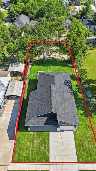 Single-story residence featuring a dark shingle roof, light-toned exterior siding, and an attached garage Single-story residence featuring a dark shingle roof, light-toned exterior siding, and an attached garage