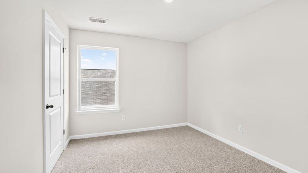 Spacious, unfurnished interior of a new home in Bentley Park, Greenwood (Image 24).