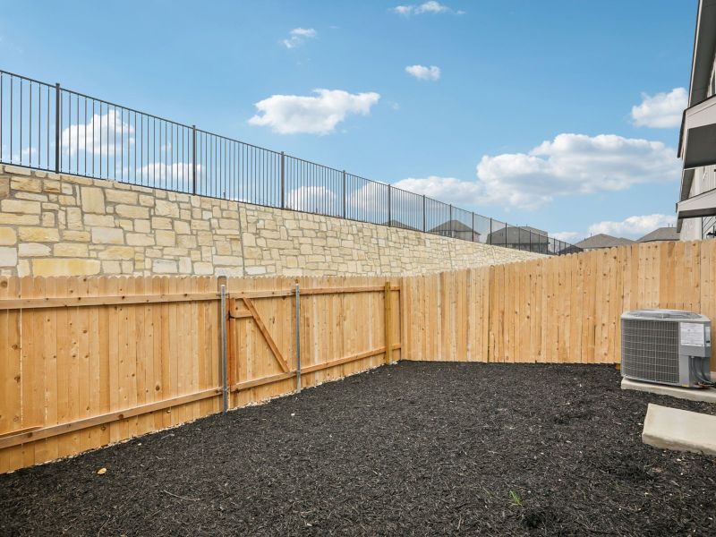 Exterior details and patio area of a home in Turner's Village, Buda (Image 3).