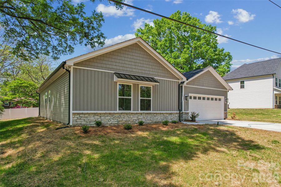 Front exterior of a new home in , Harrisburg, NC, highlighting curb appeal (Image 2). Front exterior of a new home in , Harrisburg, NC, highlighting curb appeal (Image 2).