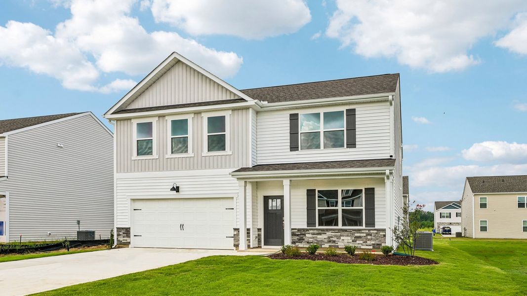 Front exterior of a new home in Shahbain Reserve, Raeford, NC, highlighting curb appeal (Image 18). Front exterior of a new home in Shahbain Reserve, Raeford, NC, highlighting curb appeal (Image 18).