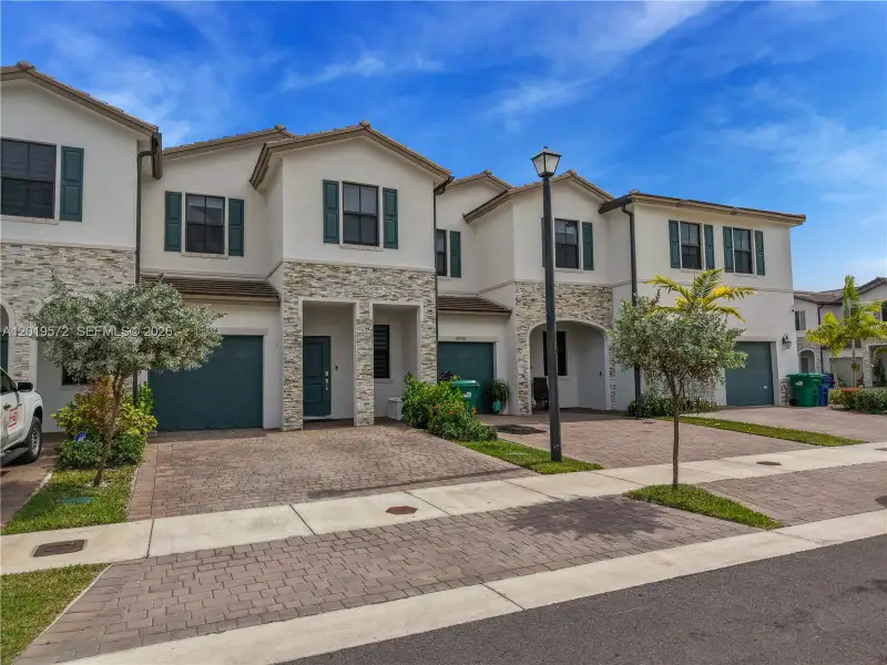 Front exterior of a new home in , Miami, FL, highlighting curb appeal (Image 1). Front exterior of a new home in , Miami, FL, highlighting curb appeal (Image 1).
