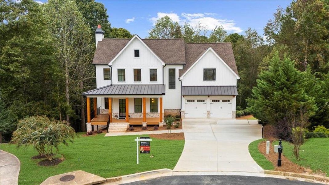 Front exterior of a new home in , Woodstock, GA, highlighting curb appeal (Image 28). Front exterior of a new home in , Woodstock, GA, highlighting curb appeal (Image 28).