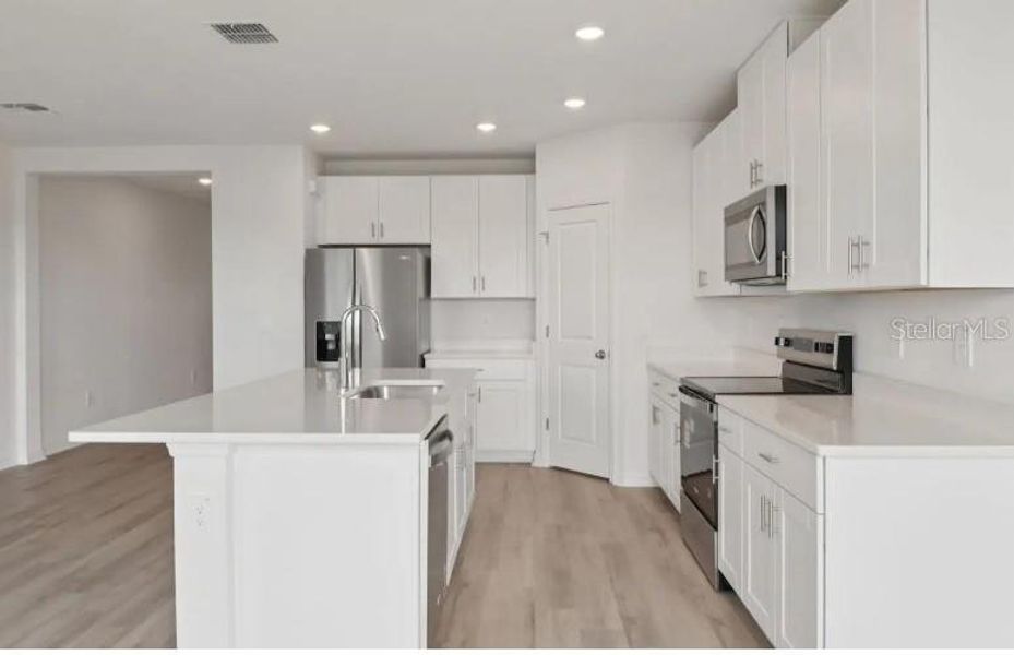 Furnished interior view inside a new home in Hilltop Vistas, Dade City (Image 6).