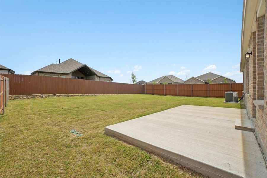 Exterior details and patio area of a home in Heartland Signature, Heartland (Image 3).