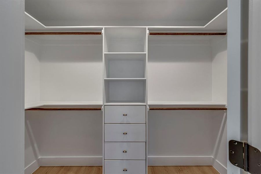 Walk in closet featuring light wood finished floors