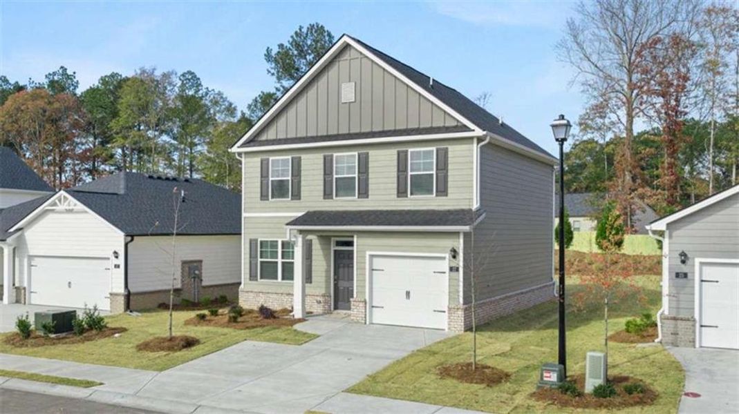 Front exterior of a new home in , Winder, GA, highlighting curb appeal (Image 2). Front exterior of a new home in , Winder, GA, highlighting curb appeal (Image 2).
