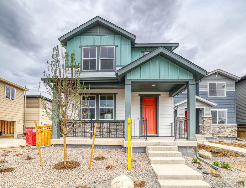 Front exterior of a new home in Painted Prairie, Aurora, CO, highlighting curb appeal (Image 16).