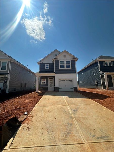 Front exterior of a new home in Brownstone Park, Easley, SC, highlighting curb appeal (Image 1).