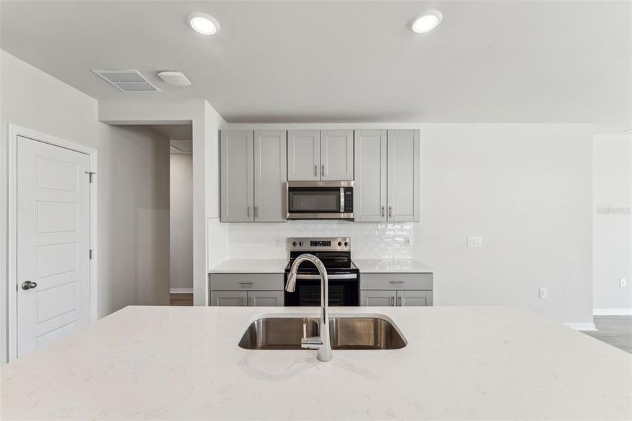 Furnished interior view inside a new home in Crescent Lakes - Premier Series, Punta Gorda (Image 11).