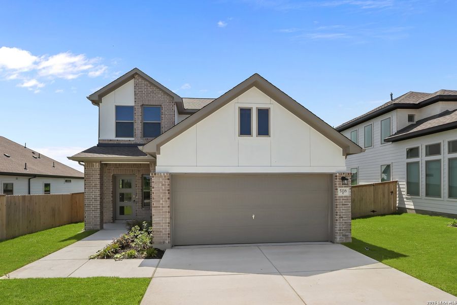Front exterior of a new home in The Parklands, Schertz, TX, highlighting curb appeal (Image 24).