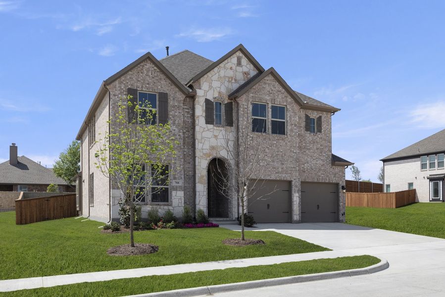 Front exterior of a new home in Providence Cove, McKinney, TX, highlighting curb appeal (Image 2). Front exterior of a new home in Providence Cove, McKinney, TX, highlighting curb appeal (Image 2).