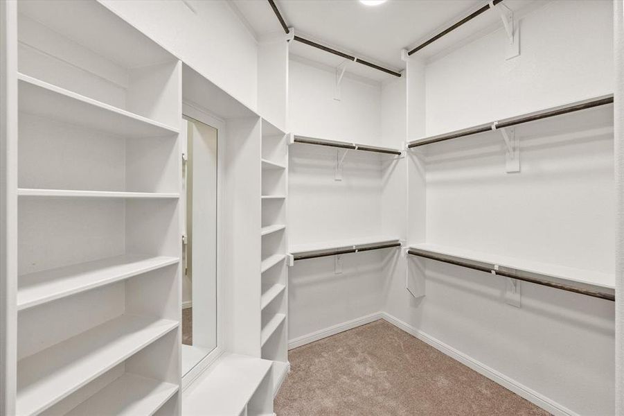 Built in mirror and bench in the primary closet!