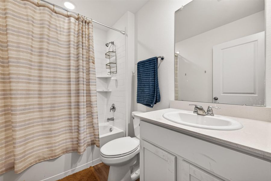 One of two bathrooms located in the hallway after the living room. One of two bathrooms located in the hallway after the living room.