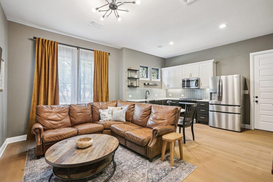 Designed for total independence and comfort, this fully private in-law space features a spacious living room separate from the main household, a full kitchen for culinary autonomy, a comfortable bedroom with a stylish bath, and its own dedicated laundry room.