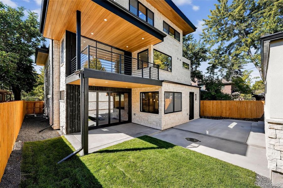 Back yard and a custom trellis between home and garage to be installed
