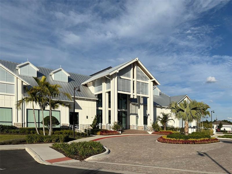 Front exterior of a new home in Del Webb Oasis, Winter Garden, FL, highlighting curb appeal (Image 2).