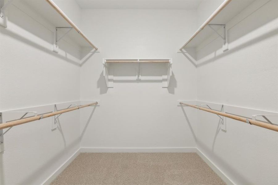Primary Closet in the Masters home plan by Trophy Signature Homes – REPRESENTATIVE PHOTO