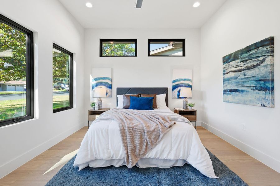 Bedroom featuring wood finished floors, a ceiling fan, and recessed lighting