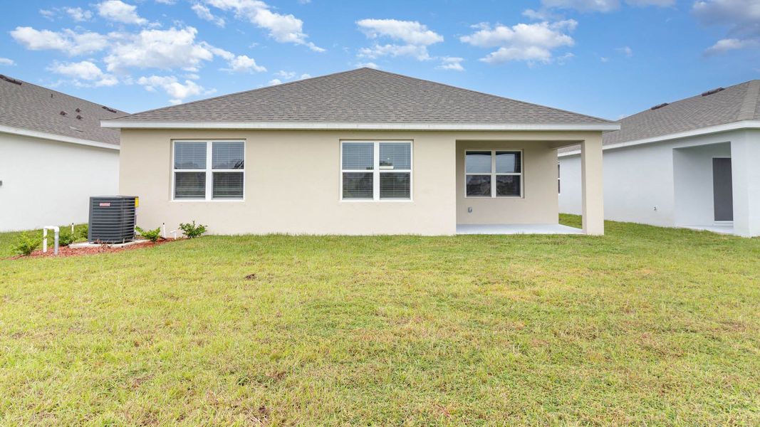 Exterior details and patio area of a home in Cypress Bay West, Palm Bay (Image 16).
