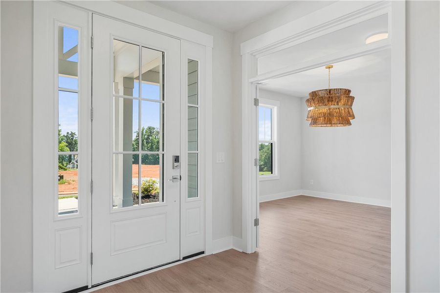 A welcoming entry features a stylish door with sid A welcoming entry features a stylish door with sid