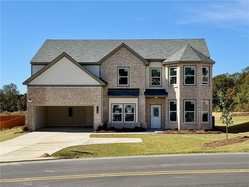 Front exterior of a new home in , Buford, GA, highlighting curb appeal (Image 2). Front exterior of a new home in , Buford, GA, highlighting curb appeal (Image 2).