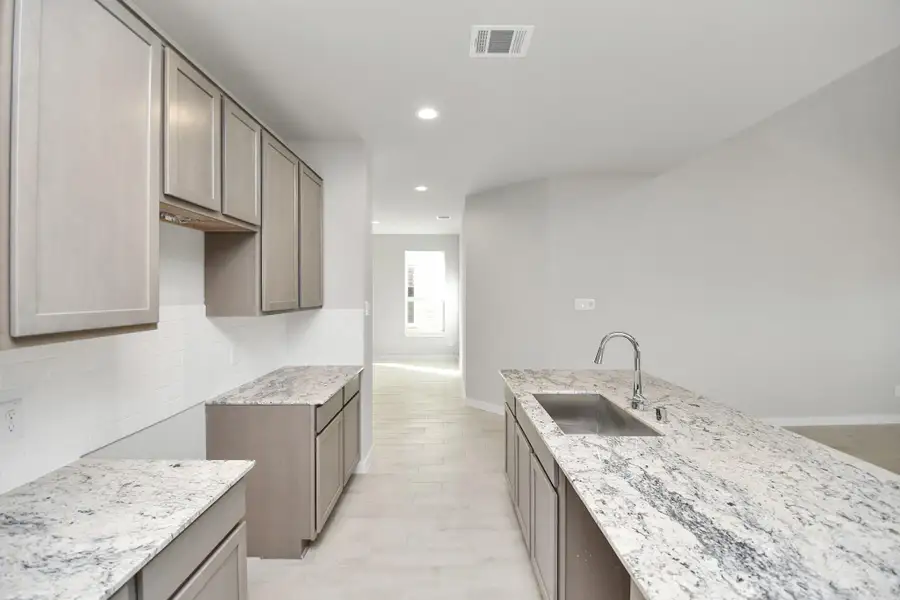 Take another look at the extended counter area that adds practicality to the stylish design. Sample photo of completed home with similar floor plan. Actual colors and selections may vary.