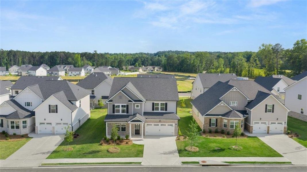 Front exterior of a new home in Wildwood, Covington, GA, highlighting curb appeal (Image 26).