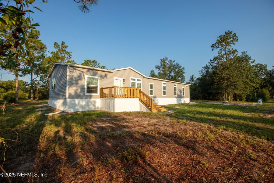 Front exterior of a new home in , Keystone Heights, FL, highlighting curb appeal (Image 28). Front exterior of a new home in , Keystone Heights, FL, highlighting curb appeal (Image 28).