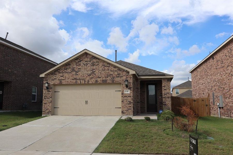 View of front of home with a garage, brick siding, driveway, and roof with shingles View of front of home with a garage, brick siding, driveway, and roof with shingles