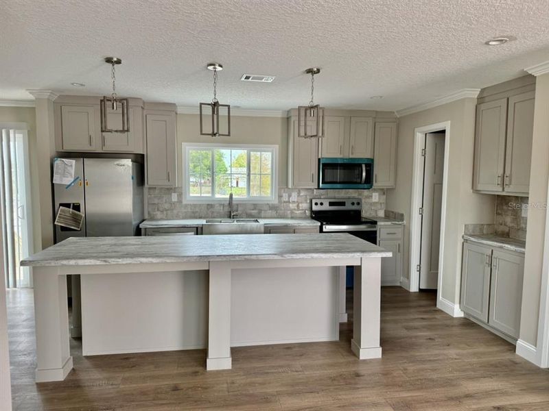 Furnished interior view inside a new home in , Okeechobee (Image 7).