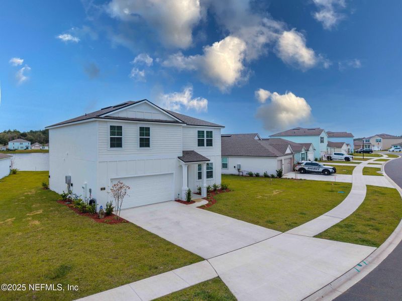 Front exterior of a new home in Entrada, St. Augustine, FL, highlighting curb appeal (Image 26).