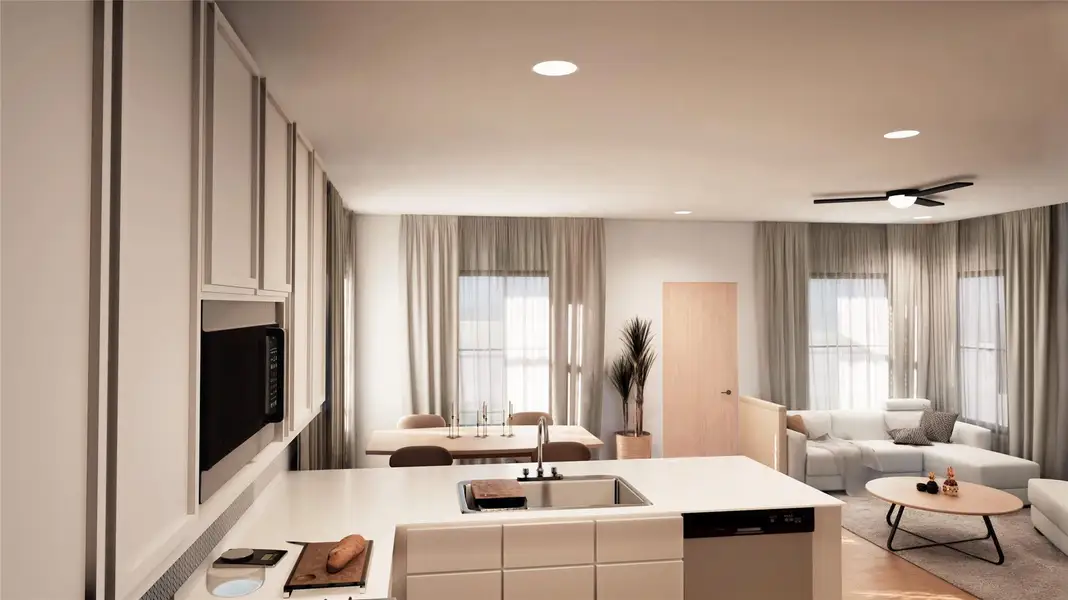 Kitchen featuring a peninsula, open floor plan, healthy amount of natural light, stainless steel dishwasher, and recessed lighting