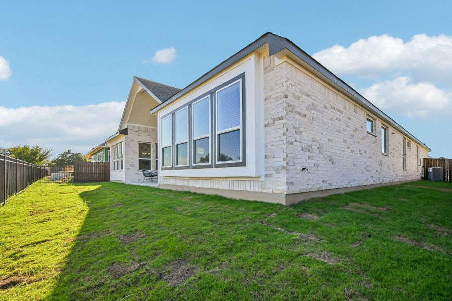 Exterior details and patio area of a home in Gregg Ranch, Marble Falls (Image 15).