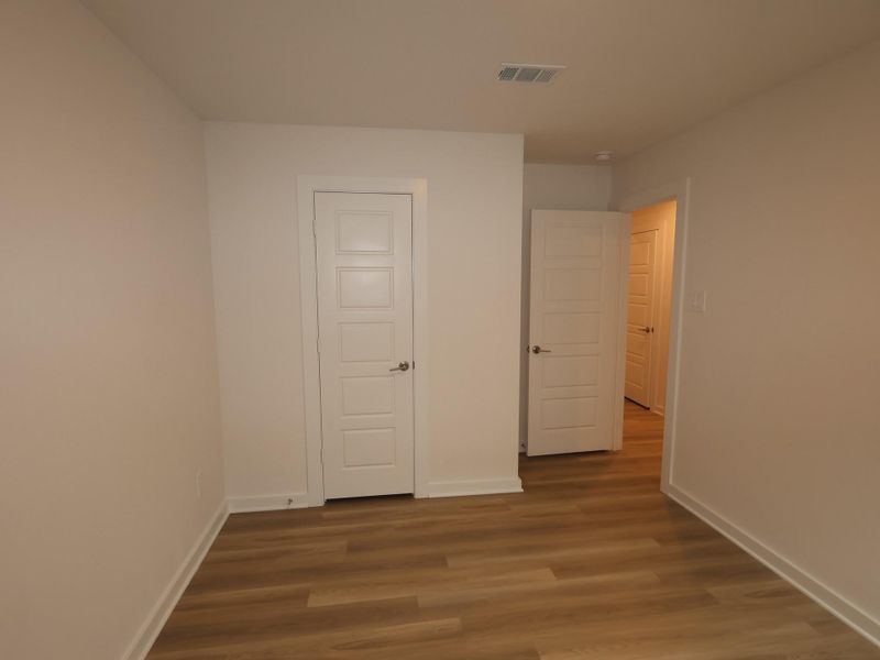 Spacious, unfurnished interior of a new home in Pinewood at Grand Texas, New Caney (Image 20).