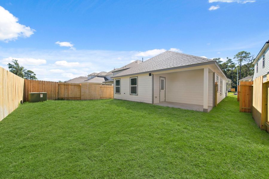 Exterior details and patio area of a home in Cypresswood Landing, Humble (Image 16).