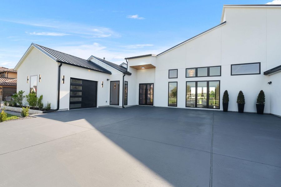 Front exterior of a new home in , Dripping Springs, TX, highlighting curb appeal (Image 25). Front exterior of a new home in , Dripping Springs, TX, highlighting curb appeal (Image 25).