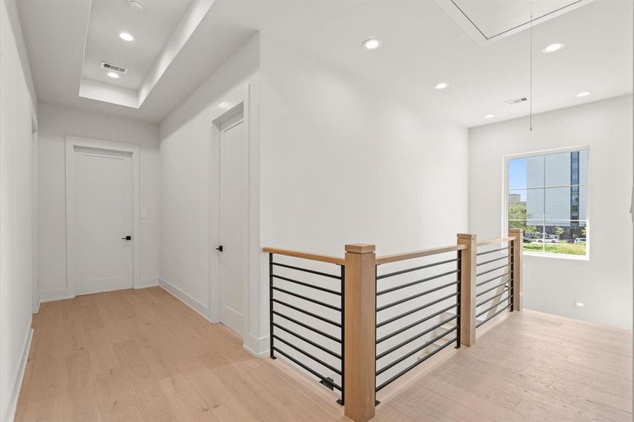 Second floor landing that really highlights the white oak flooring throughout the home. Previous TOMO Homes project.