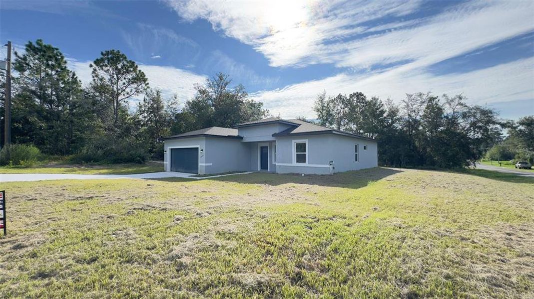 Front exterior of a new home in , Dunnellon, FL, highlighting curb appeal (Image 19).