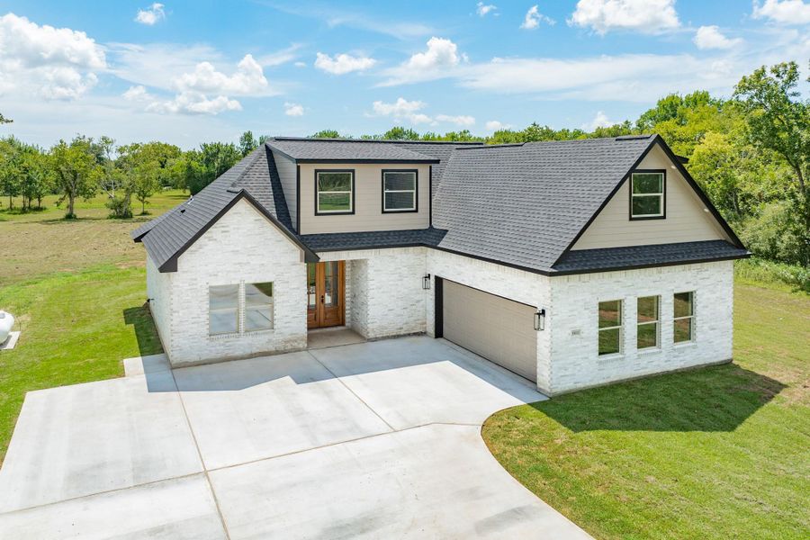 Front exterior of a new home in , Richwood, TX, highlighting curb appeal (Image 20).